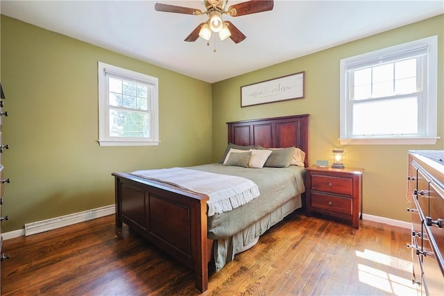 bedroom with baseboards, a ceiling fan, hardwood / wood-style flooring, and baseboard heating