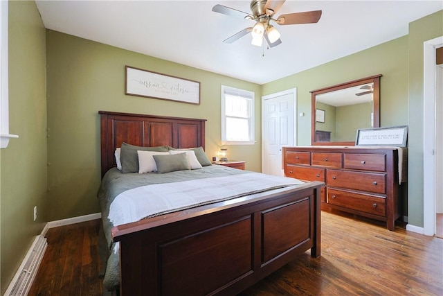 bedroom featuring baseboards, a ceiling fan, and wood finished floors