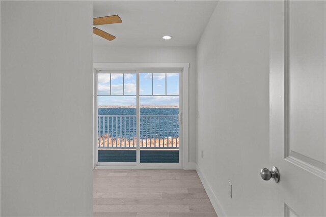 empty room with recessed lighting, light wood-style flooring, baseboards, and ceiling fan
