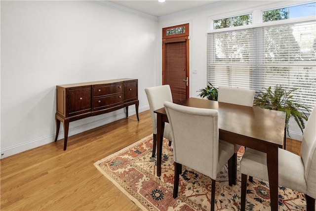 dining area featuring recessed lighting, baseboards, ornamental molding, and light wood-type flooring