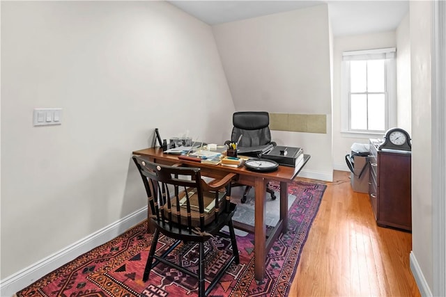 office space with light wood finished floors and baseboards