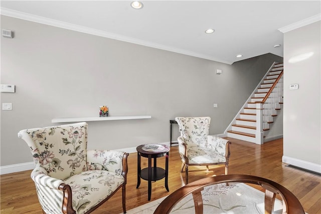 sitting room featuring recessed lighting, stairway, wood finished floors, crown molding, and baseboards