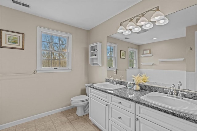 10 David Ct, East Greenwich, RI 02818 - bathroom featuring baseboards, toilet, a sink, and visible vents