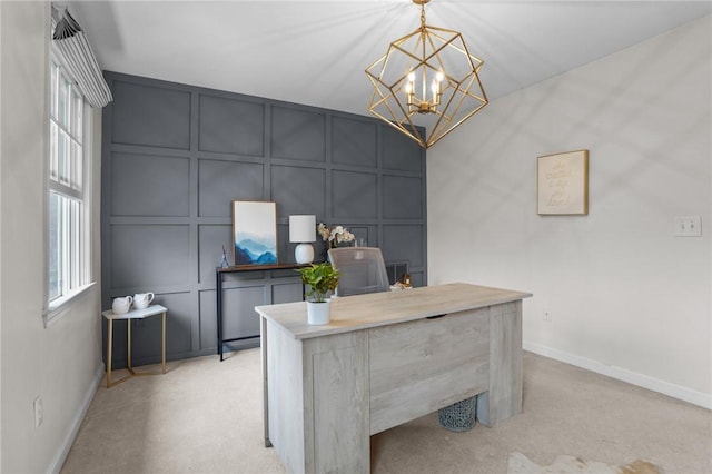 10 David Ct, East Greenwich, RI 02818 - home office with light colored carpet, a decorative wall, a notable chandelier, and baseboards