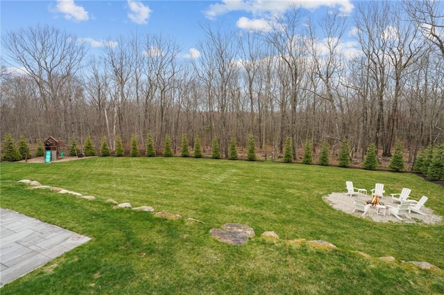10 David Ct, East Greenwich, RI 02818 - view of yard with a fire pit and a view of trees