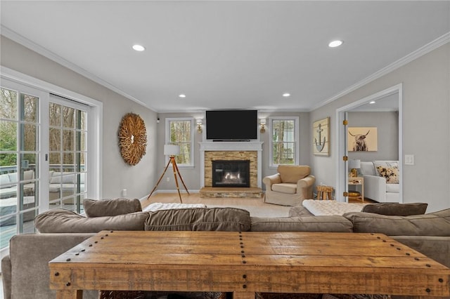 10 David Ct, East Greenwich, RI 02818 - living area with plenty of natural light, a fireplace, recessed lighting, and crown molding
