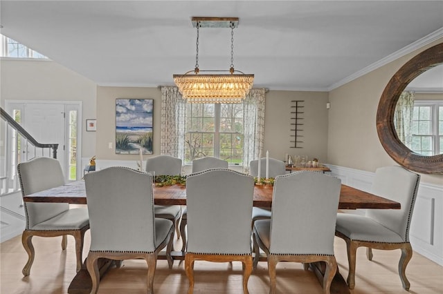 10 David Ct, East Greenwich, RI 02818 - dining space featuring wainscoting, ornamental molding, a chandelier, and light wood-style flooring