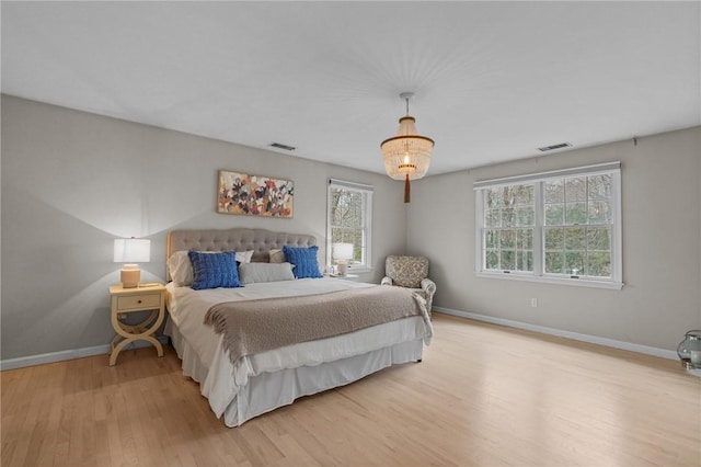 10 David Ct, East Greenwich, RI 02818 - bedroom featuring baseboards, light wood-style floors, and visible vents