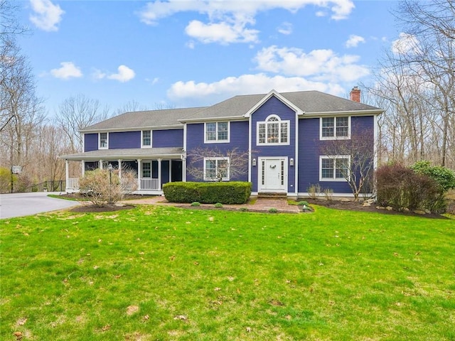 10 David Ct, East Greenwich, RI 02818 - colonial home featuring a porch, a front lawn, and a chimney