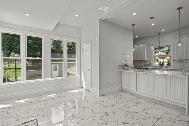 76 Bank St, North Attleboro, MA 02760 - kitchen featuring recessed lighting, a wealth of natural light, baseboards, and light stone counters