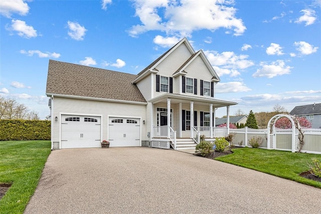 view of front of property with covered porch, aphalt driveway, fence, a garage, and a front lawn