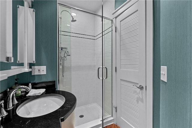 bathroom featuring vanity and a stall shower