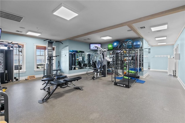 exercise room featuring baseboards and visible vents