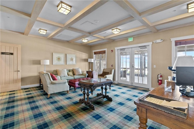 living area featuring coffered ceiling, french doors, beamed ceiling, and plenty of natural light