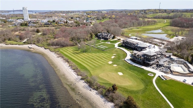 aerial view with golf course view and a water view