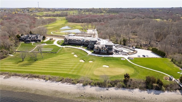 aerial view with a view of trees, a water view, and view of golf course