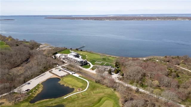 birds eye view of property featuring golf course view and a water view