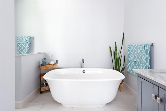 29 Reliance Dr, Bristol, RI 02809 - bathroom featuring tile patterned flooring, a soaking tub, and vanity
