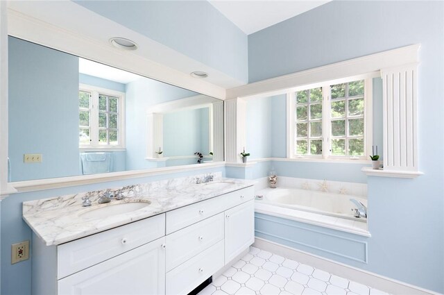 29 Reliance Dr, Bristol, RI 02809 - bathroom with a bath, tile patterned floors, a sink, and double vanity