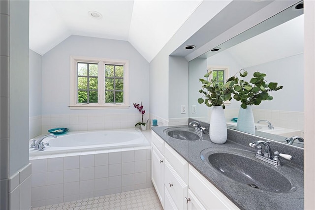 29 Reliance Dr, Bristol, RI 02809 - bathroom with a bath, lofted ceiling, tile patterned flooring, and a sink