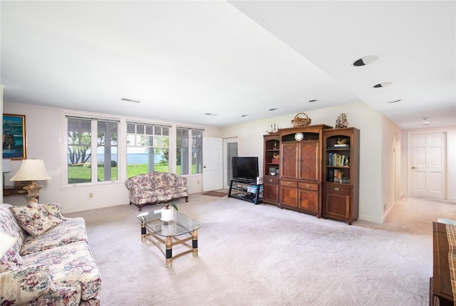 29 Reliance Dr, Bristol, RI 02809 - living area with visible vents, baseboards, and light carpet