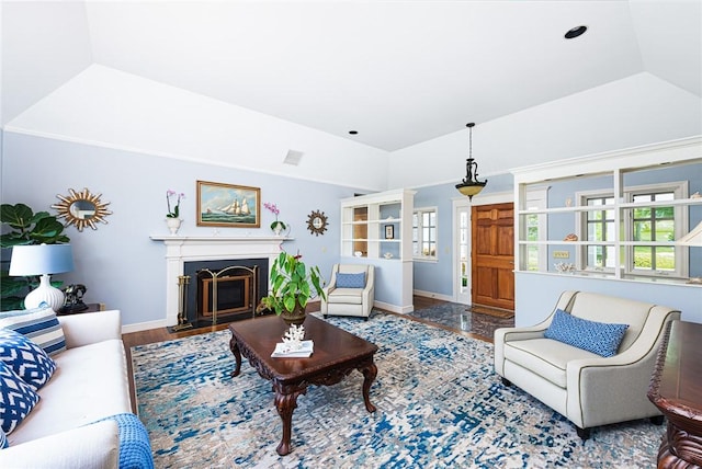 29 Reliance Dr, Bristol, RI 02809 - living area with lofted ceiling, baseboards, a wealth of natural light, and a fireplace with flush hearth