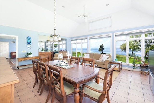 29 Reliance Dr, Bristol, RI 02809 - dining area with wine cooler, a water view, light tile patterned floors, high vaulted ceiling, and ceiling fan with notable chandelier