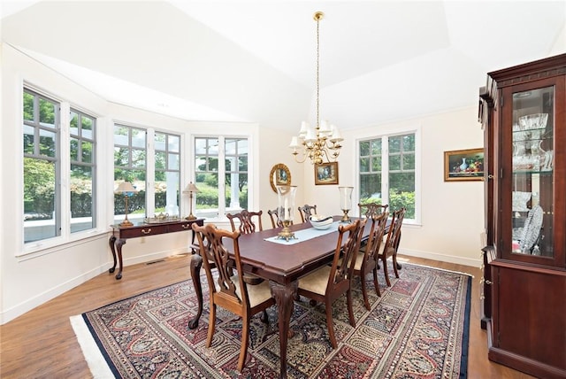 29 Reliance Dr, Bristol, RI 02809 - dining room featuring baseboards, a chandelier, and wood finished floors