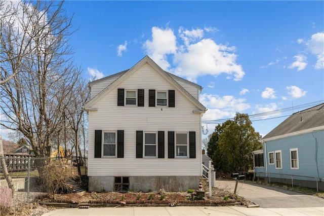 view of front of house with fence