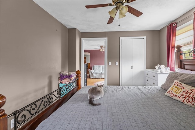 bedroom featuring ceiling fan and a closet