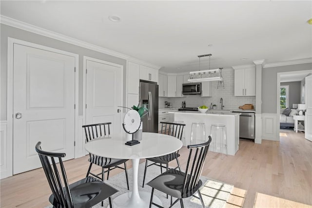 0 Greenwich Blvd Unit 203, East Greenwich, RI 02818 - dining area featuring light wood-style floors and crown molding