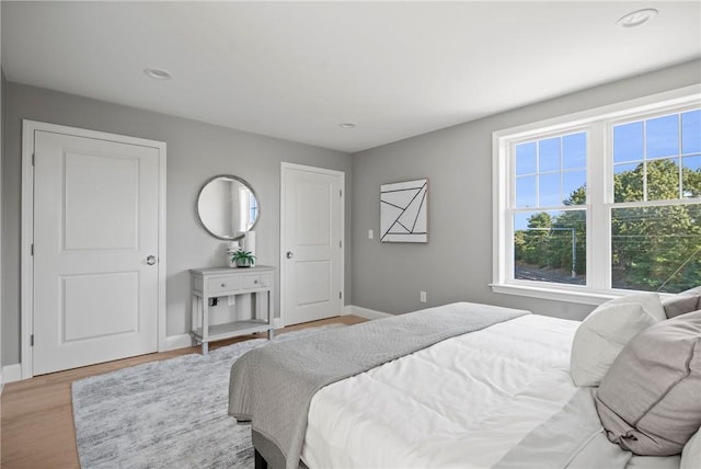 0 Greenwich Blvd Unit 203, East Greenwich, RI 02818 - bedroom with baseboards, light wood-style floors, and recessed lighting