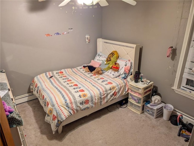 bedroom with carpet flooring, baseboard heating, and a ceiling fan