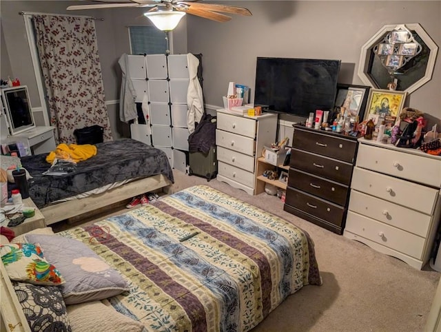 bedroom with ceiling fan and carpet