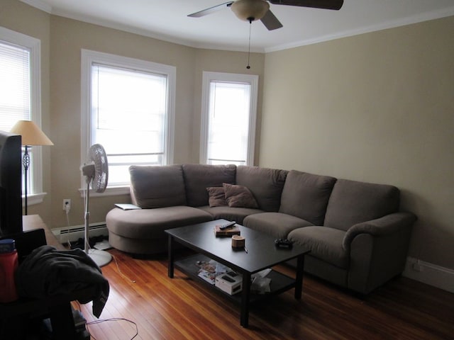 living room with ornamental molding, baseboard heating, wood finished floors, and ceiling fan
