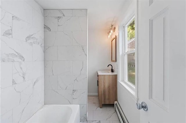 bathroom with tub / shower combination, vanity, marble finish floor, and baseboard heating