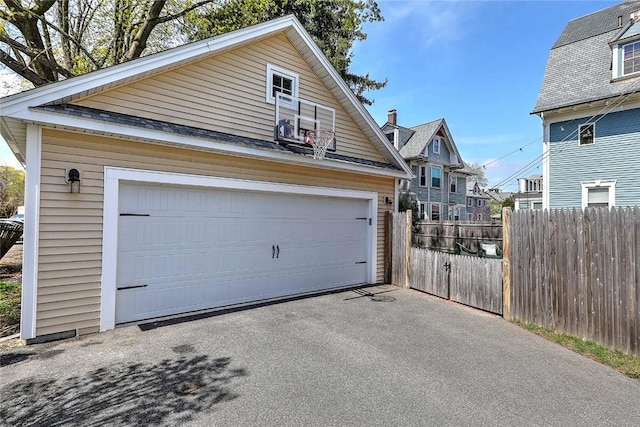garage with a garage and fence