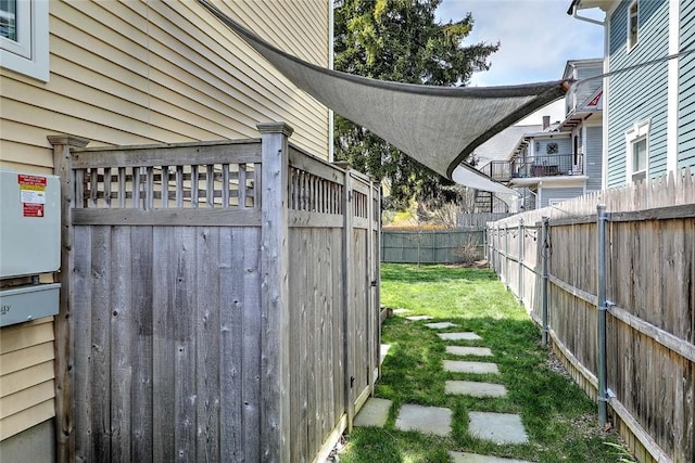 view of yard with a fenced backyard