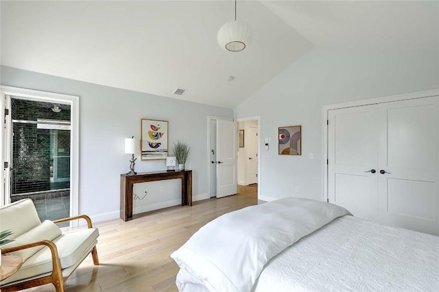 bedroom with a closet, visible vents, baseboards, high vaulted ceiling, and light wood-type flooring