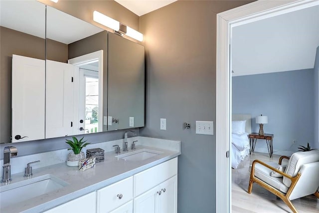 bathroom featuring double vanity and a sink