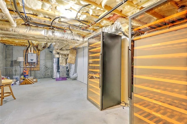 unfinished below grade area featuring water heater and heating unit
