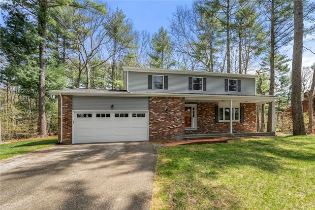 traditional home with a front lawn, aphalt driveway, covered porch, an attached garage, and brick siding