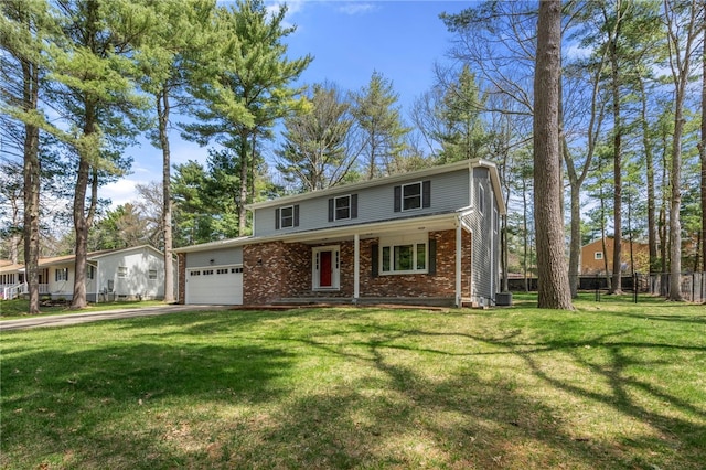 traditional-style house featuring driveway, covered porch, an attached garage, a front yard, and brick siding
