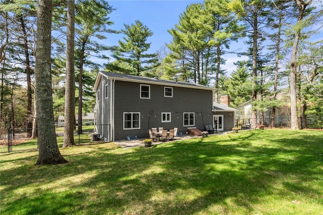 back of house with a lawn, fence, a patio area, and cooling unit