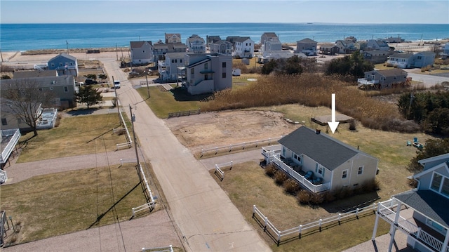 birds eye view of property with a residential view and a water view