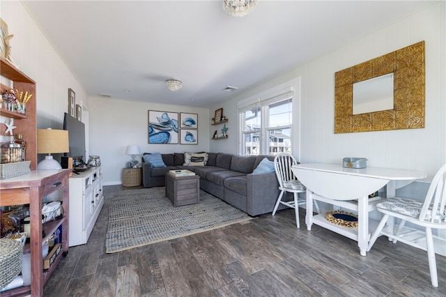 living area featuring visible vents and dark wood-style floors