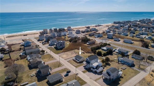bird's eye view with a view of the beach and a water view