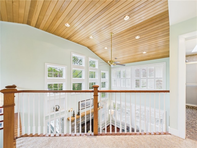 hall featuring vaulted ceiling, wood ceiling, recessed lighting, carpet floors, and baseboards