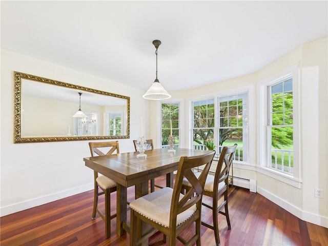 dining space featuring baseboards, dark wood-type flooring, and baseboard heating