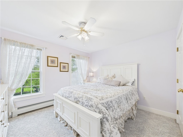 bedroom with baseboard heating, light carpet, ceiling fan, and baseboards